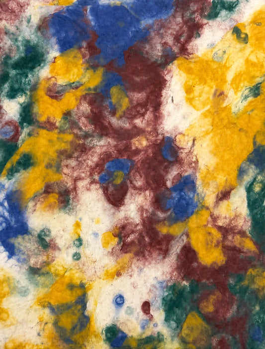 Assorted handmade paper sheets with natural textures, dyed patterns and pressed botanical details
