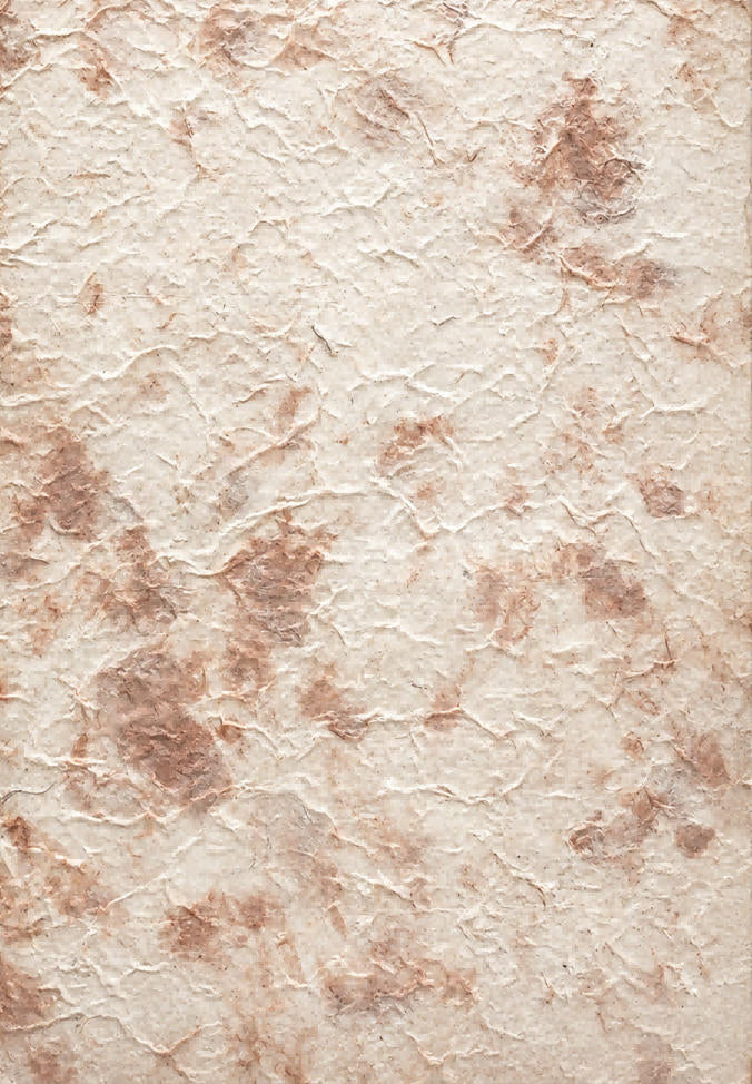 Brown tie-dyed handmade paper sheet with fibrous texture and softly mottled earth-tone pattern