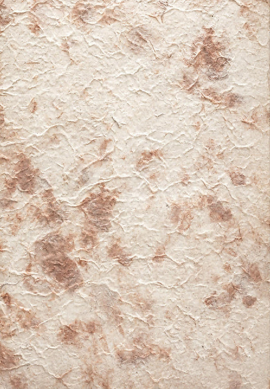 Brown tie-dyed handmade paper sheet with fibrous texture and softly mottled earth-tone pattern